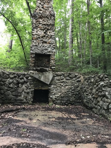 Stone foundation with fireplace.
