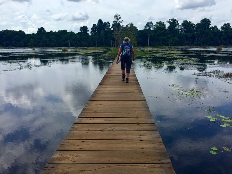 Walking the bridge to Neak Pean.