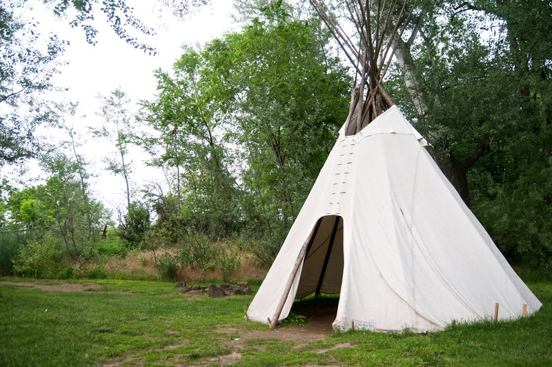 A seasonal teepee can be found in a grove of trees near the creek.