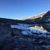 Part of the (currently snow covered) trail around Upper Titcomb Lake.