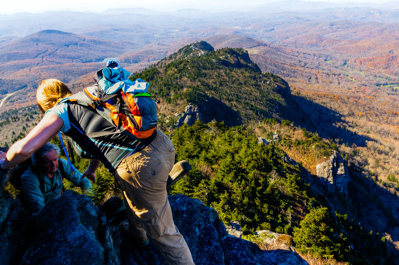 Scrambling up a rock outcrop on the Grandfather Trail.