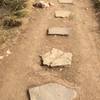 Rocks on the trail that look like steps.