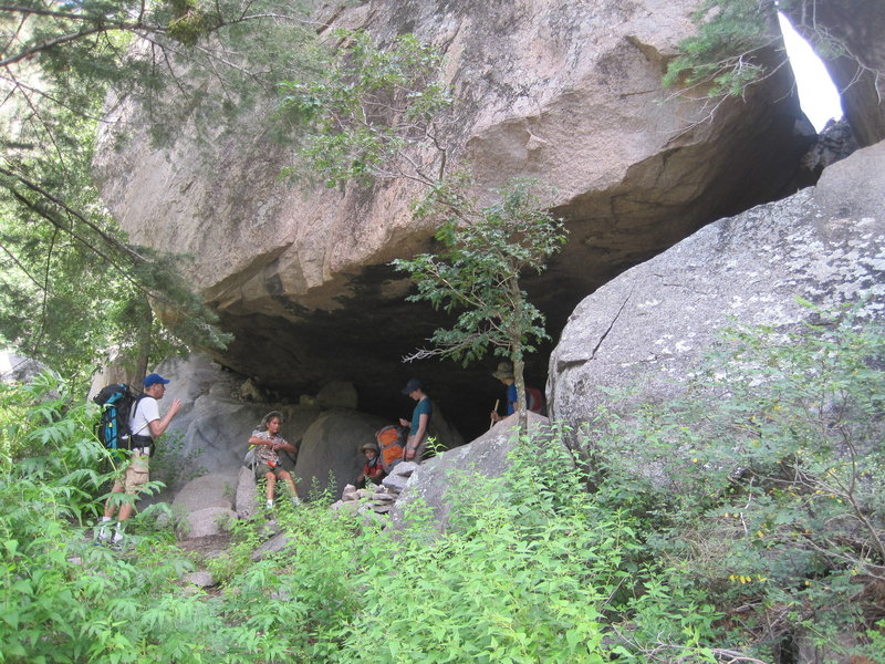 Resting under a massive overhang on the Three Rivers Trail.