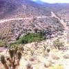 A view looking down at Grapevine Springs. A small corral with natural spring and livestock trough. Kind of odd to see in the middle of a desert.