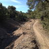 Smooth singletrack paralleling a stream bed