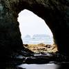 Checking out some sea stacks through hole-in-the-wall.