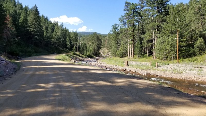 The road climbs slowly along the creek.