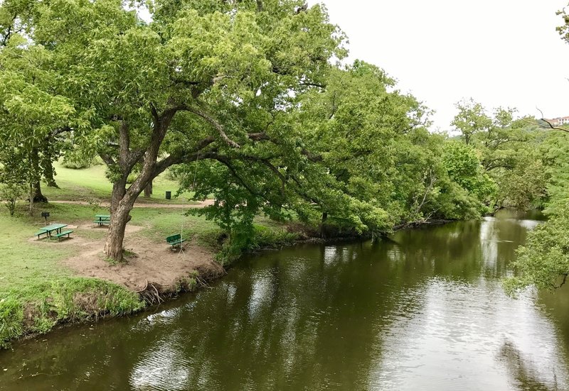 The trail winds along the shore of the creek...with picnic benches and rope swing  (make sure the water is up high enough before swinging out ;)