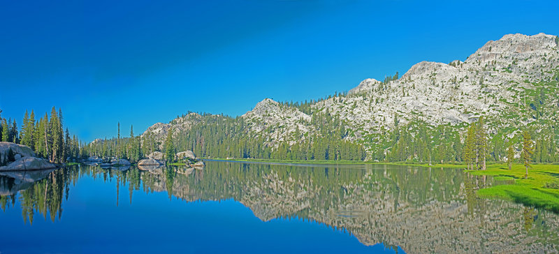 Upper Buck Lake is grassy and shallow on the west and north ends, but has rocky inlets and good campsites on the eastern side.