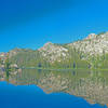 Upper Buck Lake is grassy and shallow on the west and north ends, but has rocky inlets and good campsites on the eastern side.