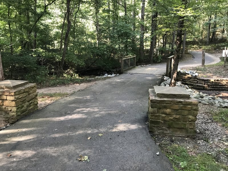 Base of the hill. Creek runs under the bridge. This leads up to the waterfall.