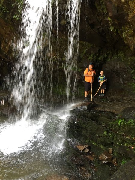 Standing behind Grotto Falls with my son.