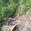 The initial plunge into the gorge is quite steep and rocky, with bedrock steps and water bars.