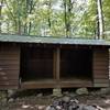 Cove Mountain Shelter. This site is in very good condition. There is a picnic table and fire ring. There is a privy about 200 feet from the shelter.