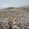 Suffering through some weather during return from Stanley Mountain summit