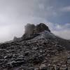 The summit outcrop; the easiest path is around back and on the South side.