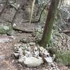 Land of the Cairns as you climb up switchbacks under thick tree canopy