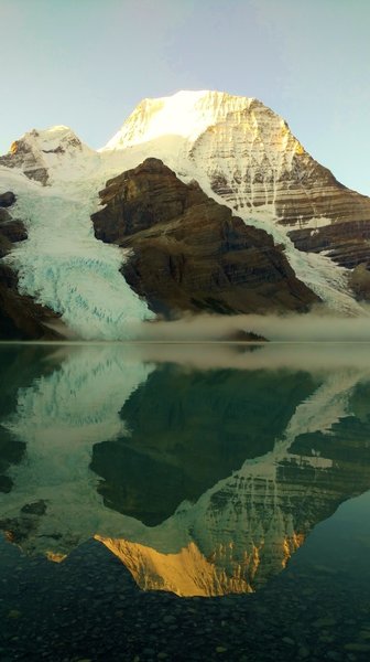 Mt. Robson reflecting into Berg Lake on a clear, still morning