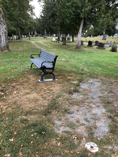 White markers and dots trace the trail through the cemetery.