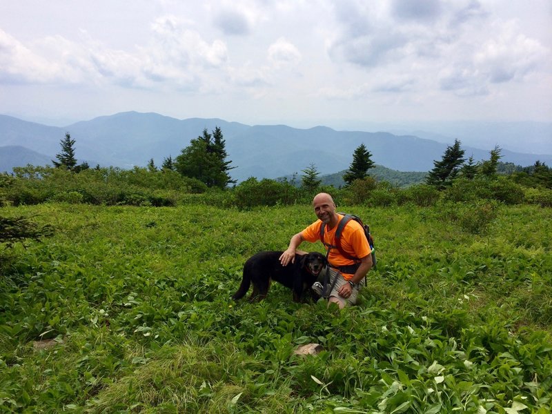 This is the meadow at the top. And this is Bodhi. He is not our dog; he was a dog from the neighborhood who led us up the trail. At one point he surprised us at the other end of a crawl through space.