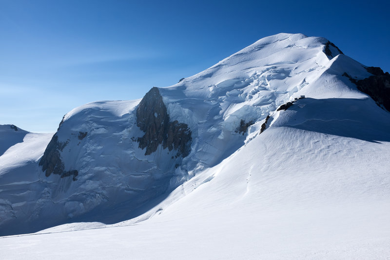 Looking up at the summit of Mt. Blanc. The Bosses Ridge is on the right, with the Vallot Hut at the base of it.