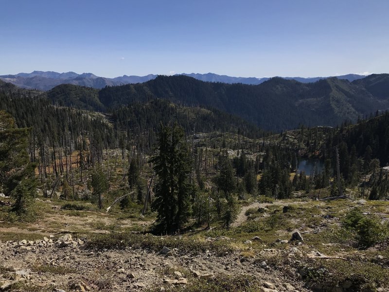 View from Haypress Trail looking east down on Monument Lake with Pacific Crest in far background