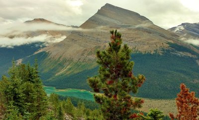 Titkana Peak with beautiful, bluegreen Adolphus Lake far below, looking east-southeast from high on Mumm Basin Route