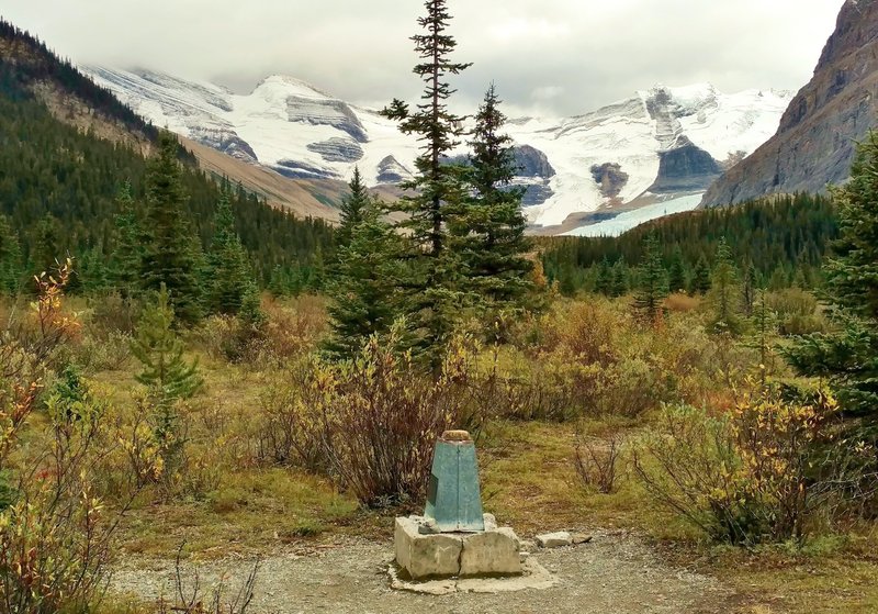 Alberta - British Columbia boundary marker. Alberta on the left, British Columbia on the right. Oh, and a lot of big snowy mountains and glaciers too. Looking southeast at Robson Pass on the Continental Divide.
