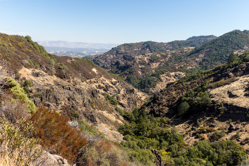 Valley cut into the volcanic rock next to Oat Hill Mine Trail.