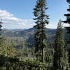 View of privately owned Jackson Lake and Trinity Alps Wilderness in the background from the Bingham Lake Trail.