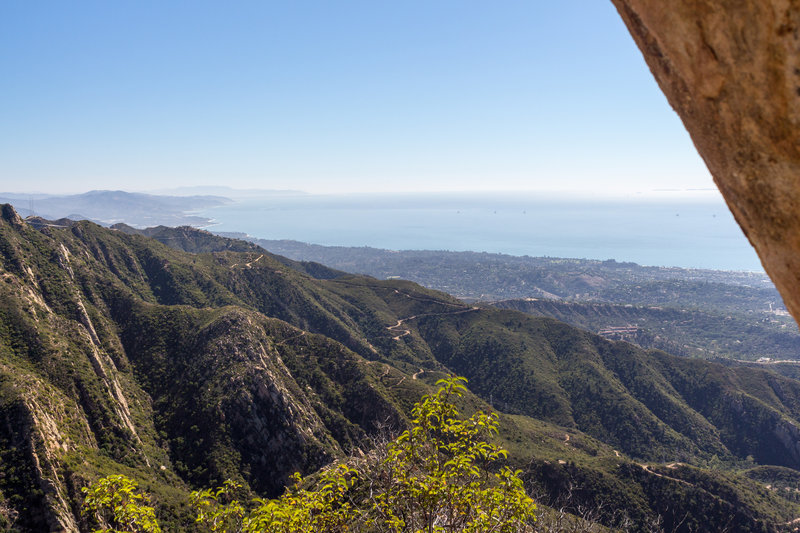 Taking a breath from the steep ascent on Cathedral Peak Trail offers stunning views of the coastal area.