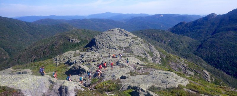 Little Haystack and view northeast through Johns Brook Valley to Big Slide. Shoulder of Marcy to the left, partial view of continuation of Great Range to right, and parts of Basin.