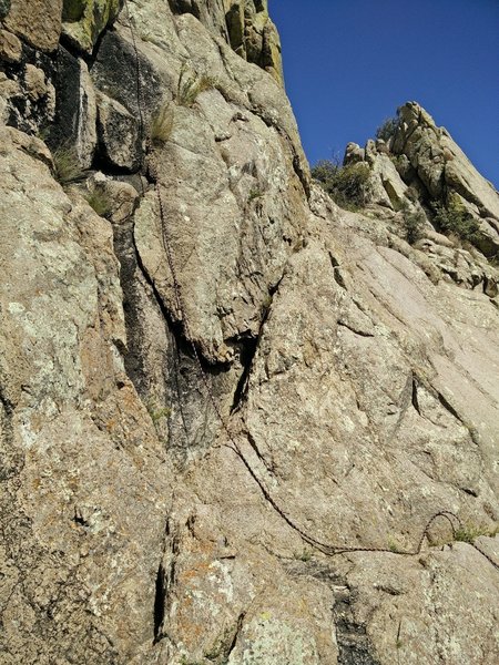 The diagonal seam; climb this to reach the peak via a last short ascent.