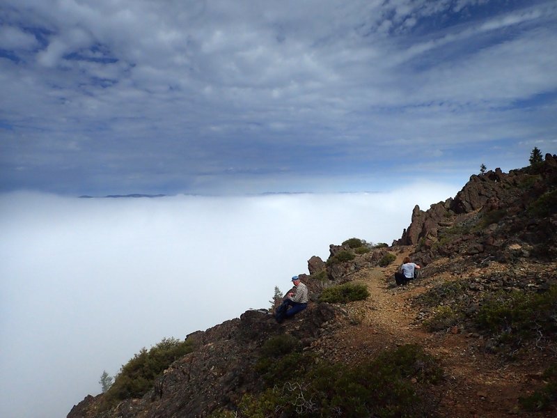 Above a sea of clouds at the end of the steep part of the trail