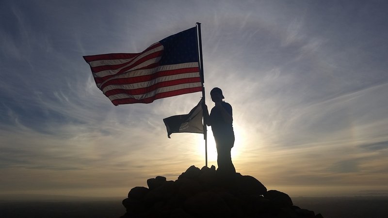 View of the flags on the summit of Mother Miguel Mountain at sunset