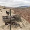 Dog pondering what's ahead... a narrow ridge affording sweeping views.