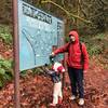 John and Cole are pointing to their current location on the beautiful trail map at the entry to the natural area.