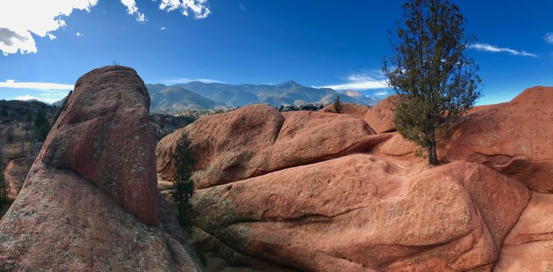 Looking at the Rampart Range from the red rocks of the Contemplative Trail