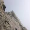 Climbing the easy 6" diagonal seam at the top of the gully.