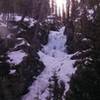 The falls are mostly frozen.