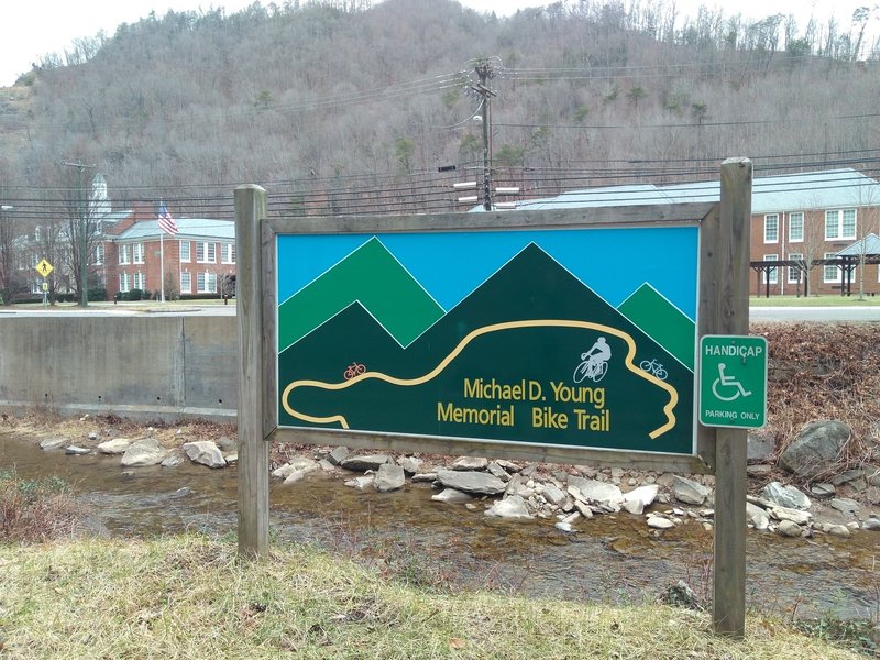 Parking and western trailhead of Michael D. Young Memorial Bike Trail. Across the creek from Appalachian School of Law