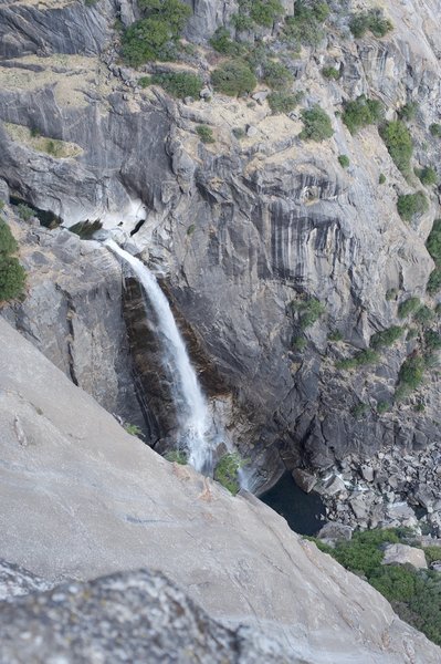 From Oh My Gosh Rock, the only view of Lower Yosemite Falls along the trail can be enjoyed. Here, water drops over Lower Yosemite Falls in the winter.