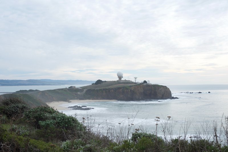 Pillar Point Air Force Station sits off in the distance above the Pacific.