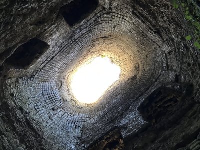 Looking up the lime kiln chimney. Note the four holes on the side if the walls.