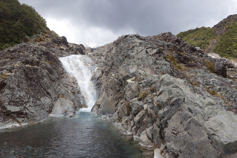 The Lake Surprise trail scrambles up the rocks to the right of this waterfall