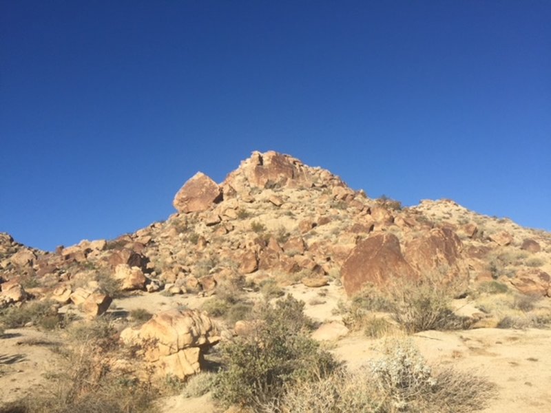 View west of some of the rocky terrain that you'll pass.