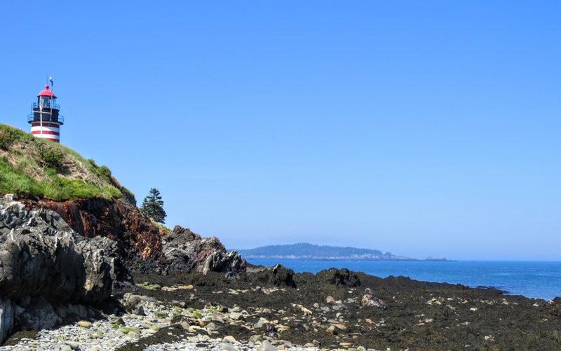 Low tide offers a unique view of West Quoddy Head Light, one of the many viewpoints in Down East Maine