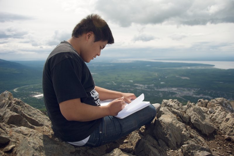 Signing the summit journal of Mt. Baldy.