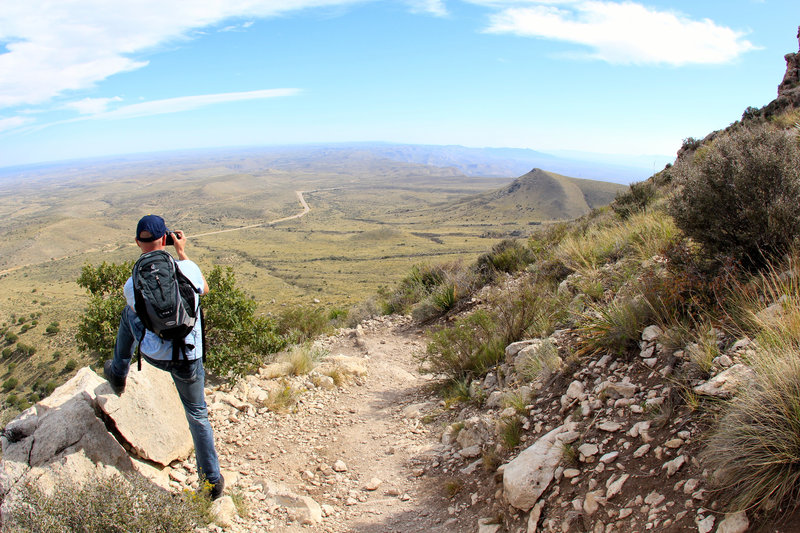 Tourist and hiker taking pictures on the Guadalupe Peak Trail.