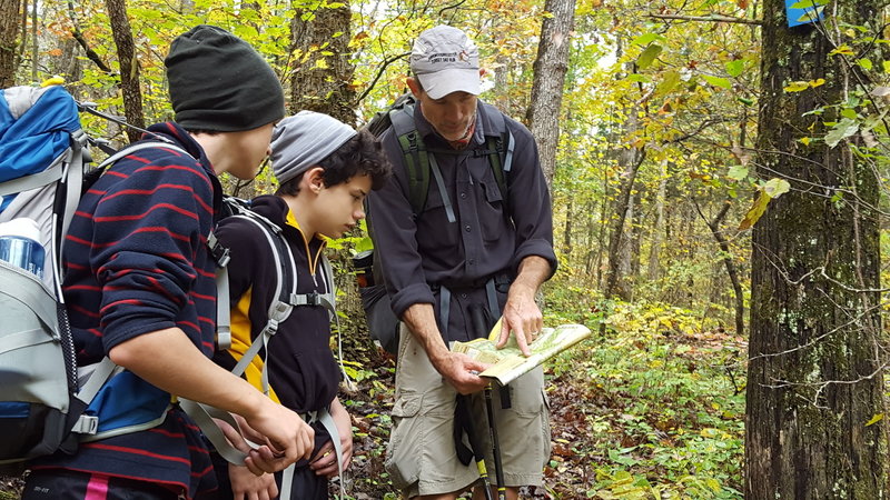 Checking the map on an October hike.